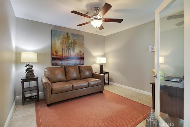 living room with ceiling fan and tile patterned floors