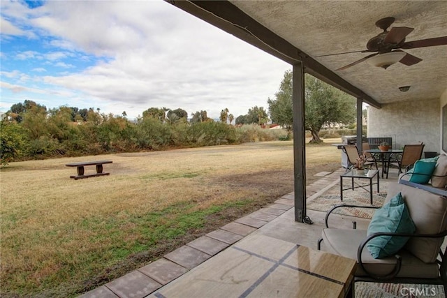 view of patio / terrace featuring ceiling fan