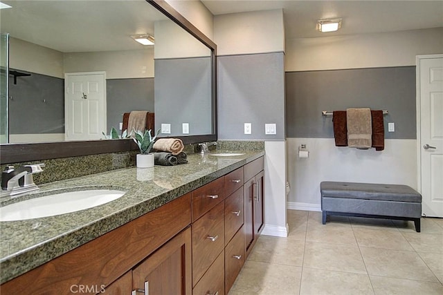 bathroom with vanity and tile patterned flooring