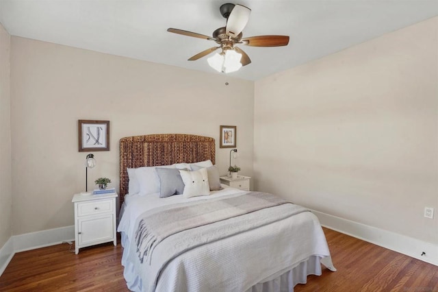 bedroom featuring dark wood-type flooring and ceiling fan