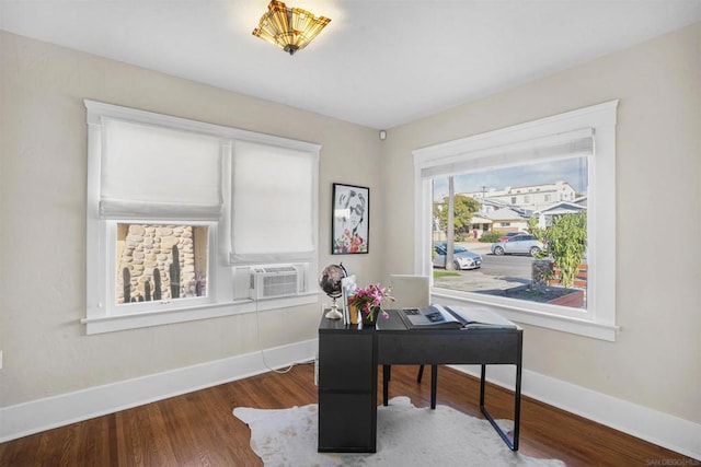 office area with hardwood / wood-style flooring and cooling unit