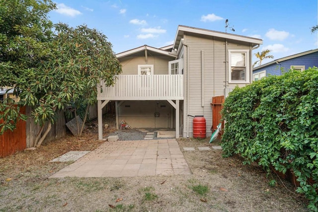 rear view of property featuring a patio area