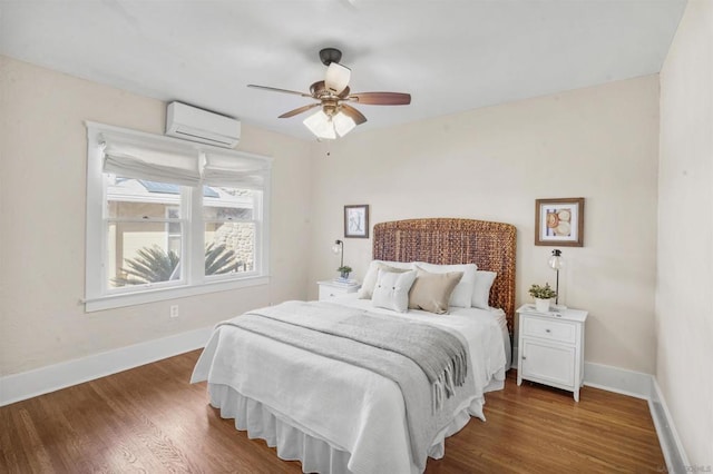 bedroom featuring ceiling fan, dark hardwood / wood-style floors, and an AC wall unit