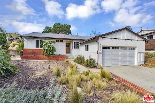 ranch-style home featuring a garage