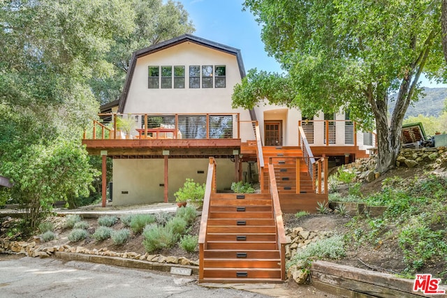 view of front of house featuring a deck