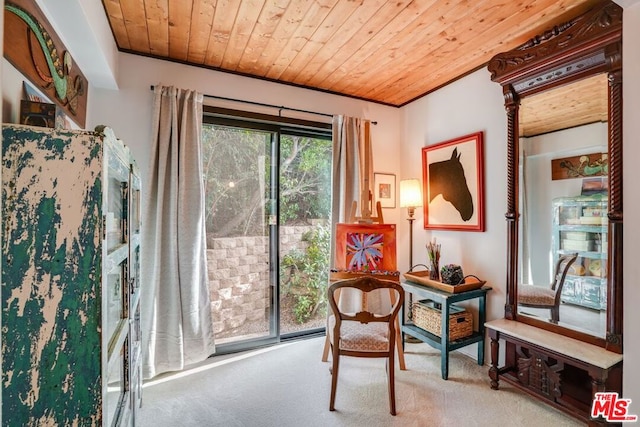 sitting room with light colored carpet, ornamental molding, and wooden ceiling