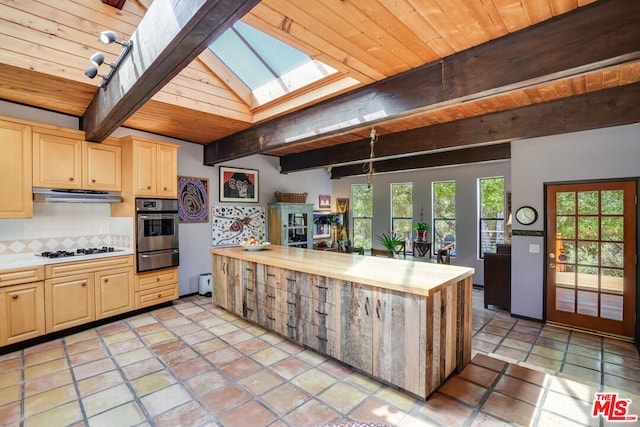 kitchen featuring wood ceiling, tasteful backsplash, beamed ceiling, white gas stovetop, and stainless steel oven