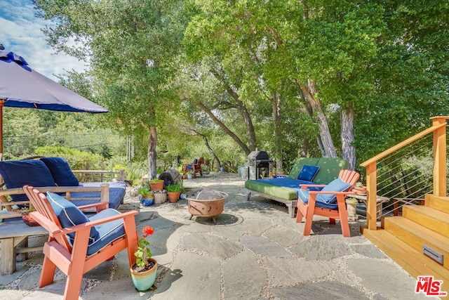 view of patio / terrace with a fire pit