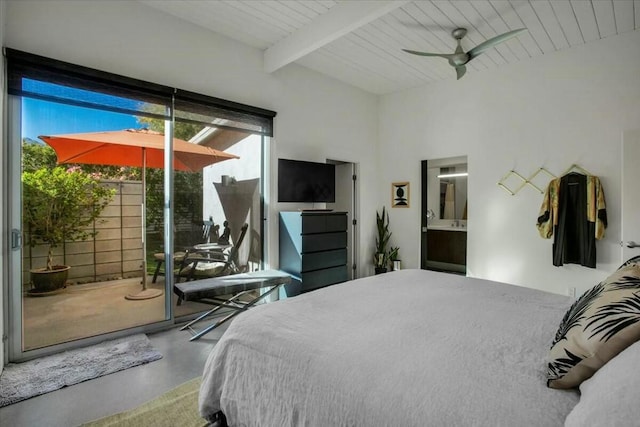 bedroom featuring ensuite bath, concrete floors, access to outside, beamed ceiling, and ceiling fan