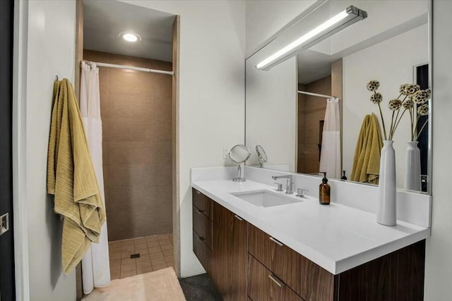 bathroom with vanity, tile patterned floors, and walk in shower