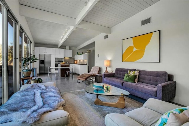 living room with beam ceiling