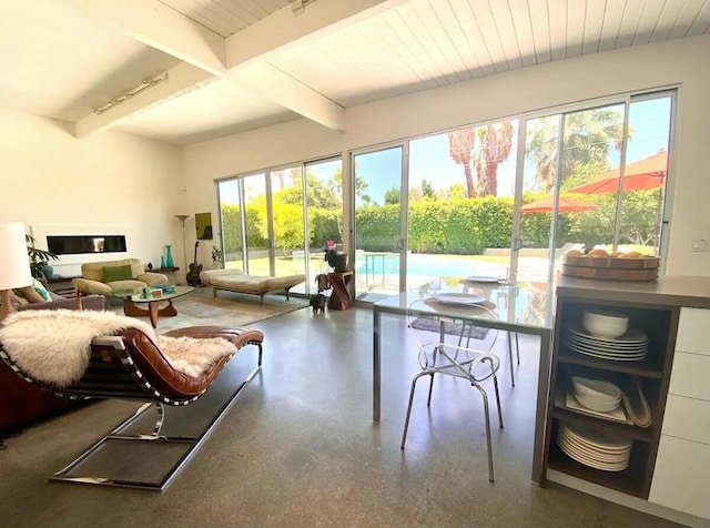 sunroom / solarium featuring beamed ceiling and wooden ceiling