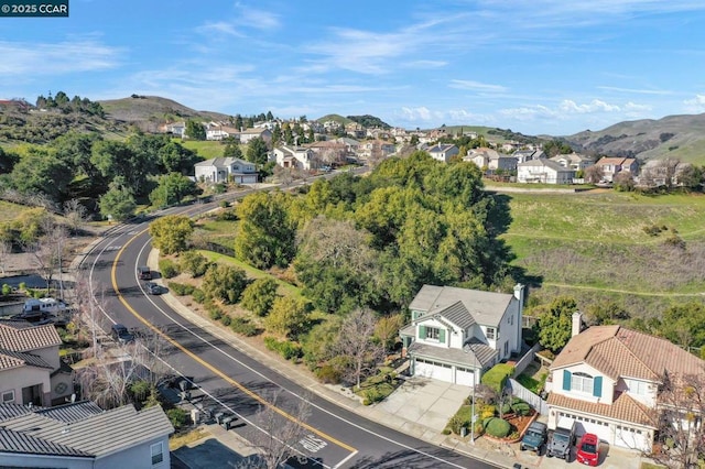 drone / aerial view featuring a mountain view