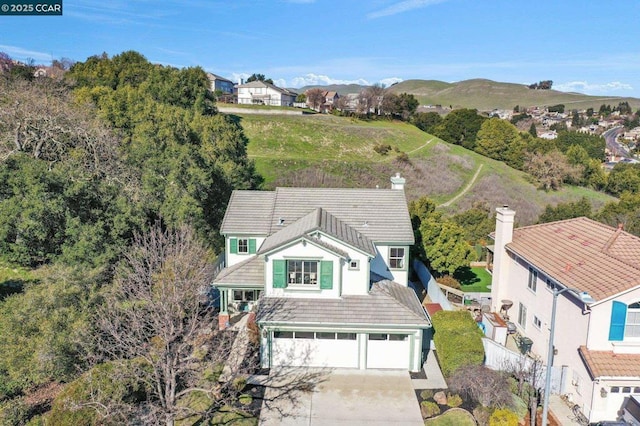 birds eye view of property featuring a mountain view