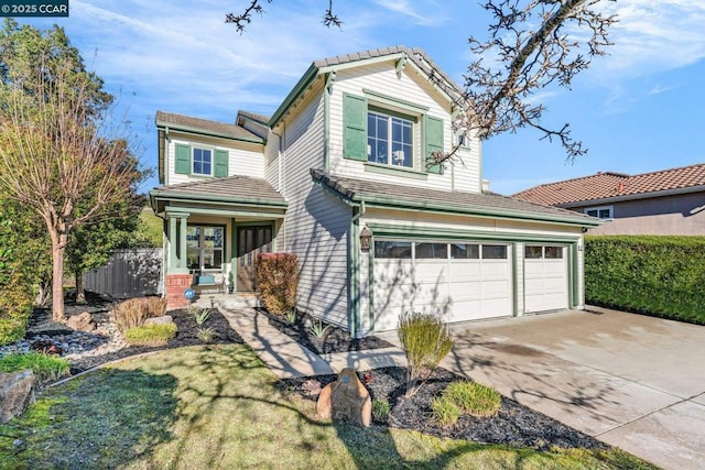 view of front of house with a garage, a porch, and a front lawn