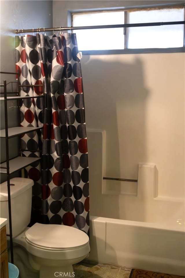 bathroom with vanity and shower / tub combo with curtain