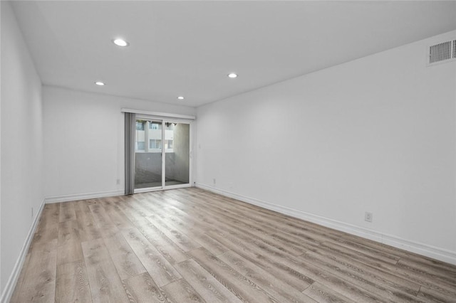 unfurnished room with light wood-type flooring