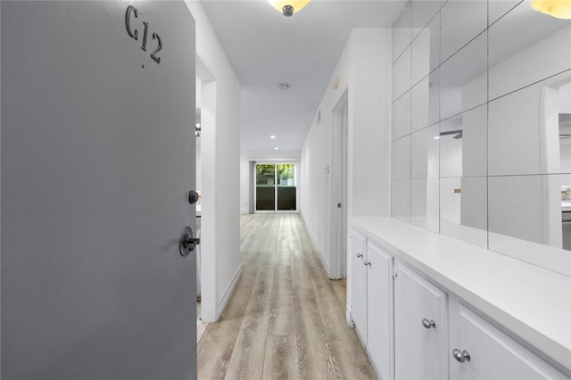 corridor featuring light hardwood / wood-style floors