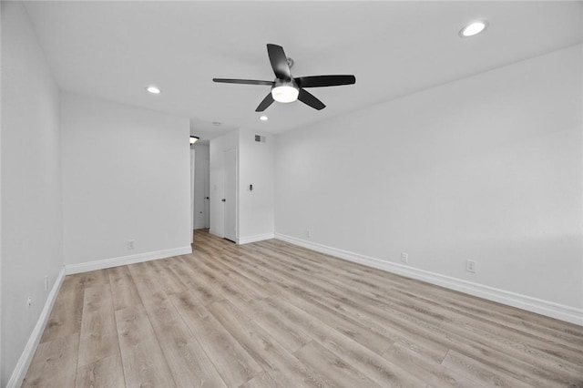 empty room featuring ceiling fan and light hardwood / wood-style floors