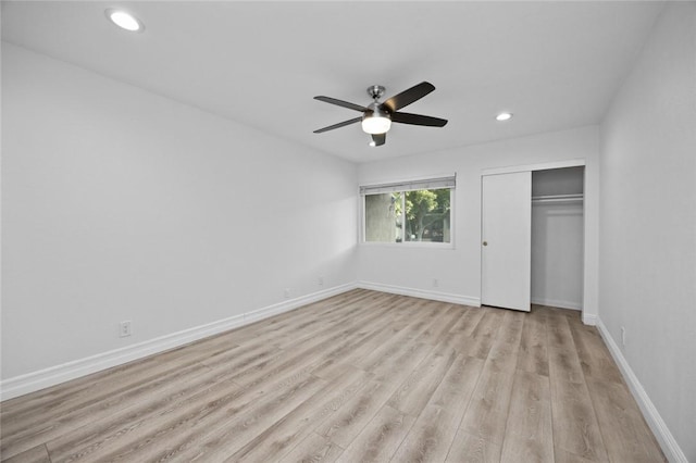 unfurnished bedroom with a closet, ceiling fan, and light hardwood / wood-style flooring