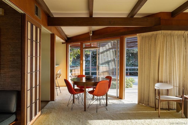 sunroom with lofted ceiling with beams