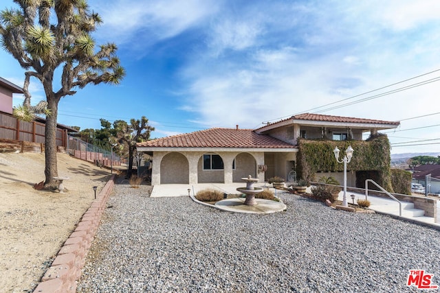 view of front of home with a patio