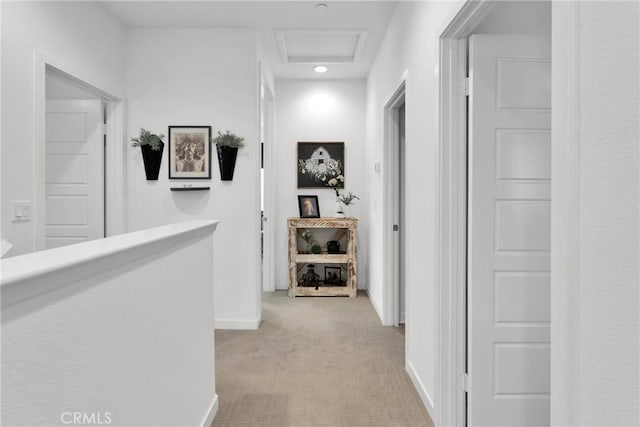 hallway featuring light carpet