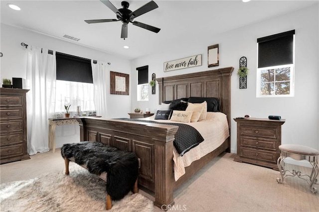 carpeted bedroom with ceiling fan