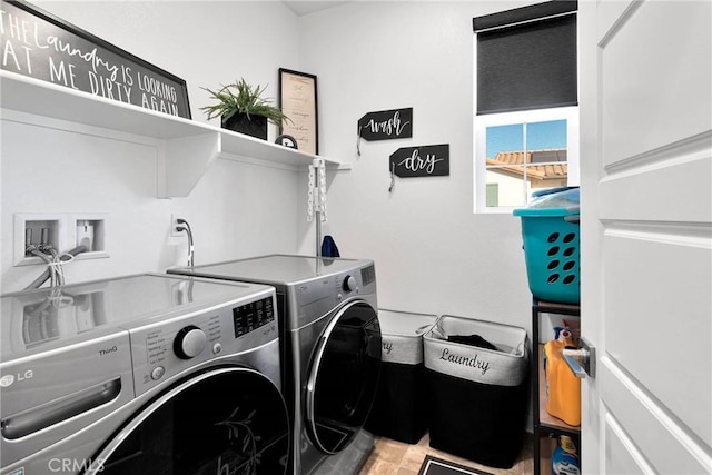 clothes washing area featuring washer and clothes dryer