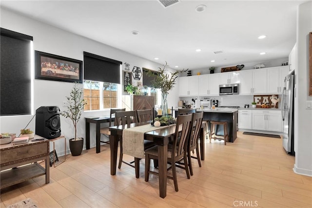 dining room featuring light wood-type flooring