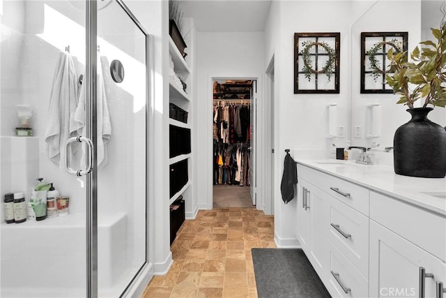 bathroom featuring vanity and walk in shower