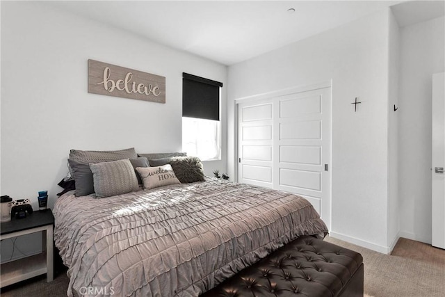 carpeted bedroom with a closet