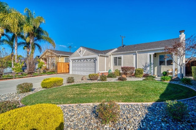 single story home with a garage and a front lawn