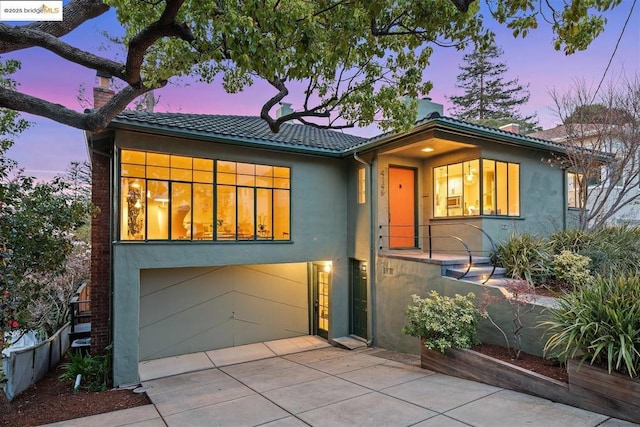 view of front of property featuring a garage