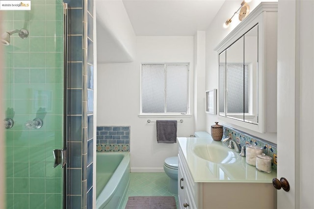 full bathroom with vanity, toilet, tile patterned flooring, and shower with separate bathtub