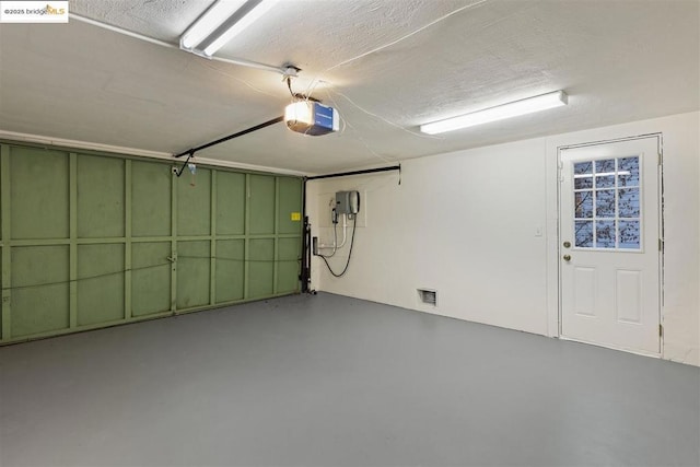 garage featuring a garage door opener