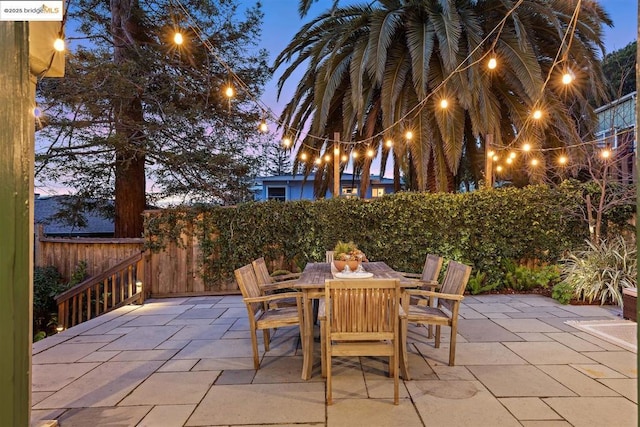 view of patio terrace at dusk