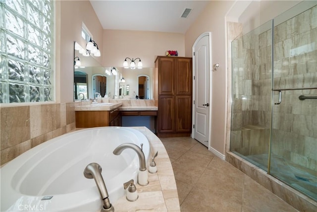 bathroom featuring vanity, tile patterned flooring, and shower with separate bathtub