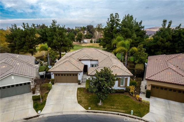 view of front of property with a garage and a front yard