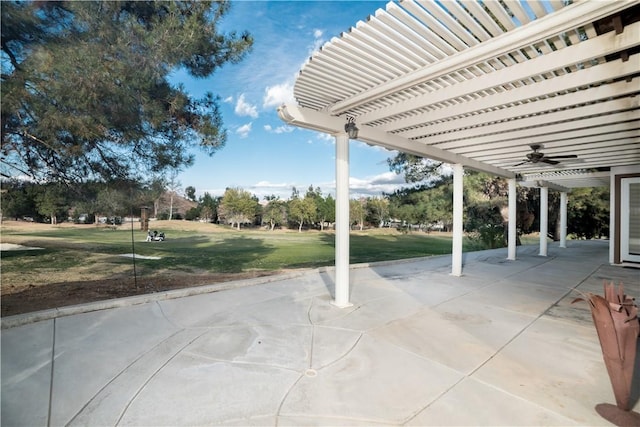 view of patio with ceiling fan and a pergola