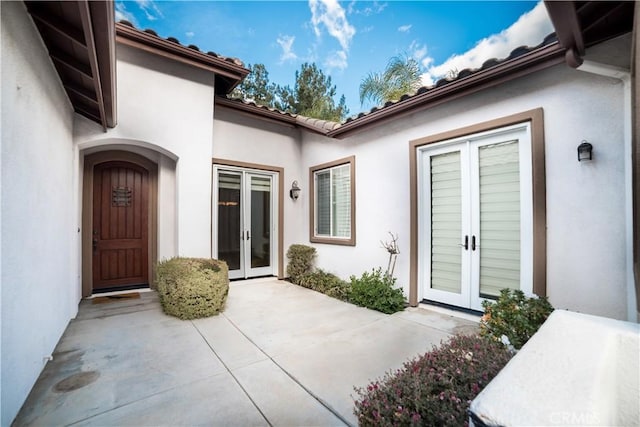 doorway to property featuring french doors and a patio area