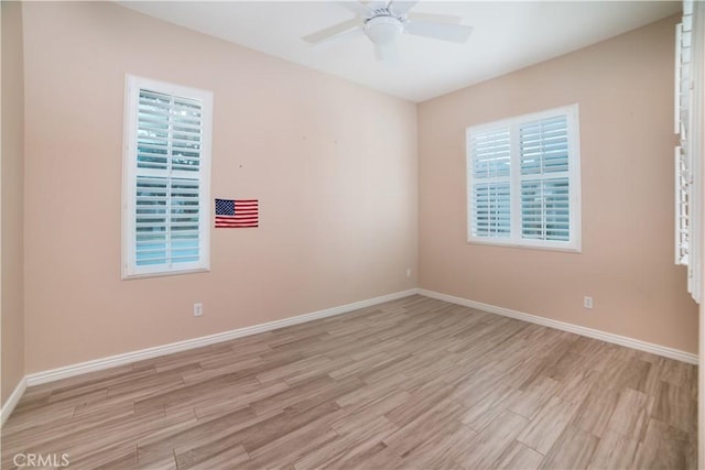 spare room featuring ceiling fan and light hardwood / wood-style floors