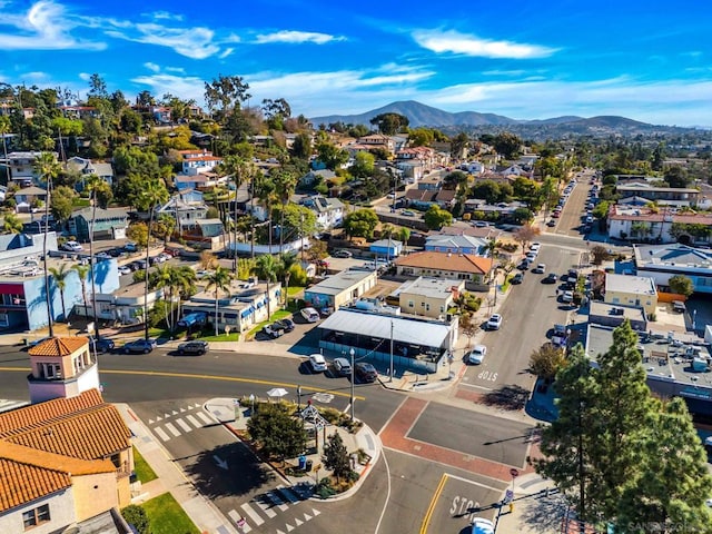 birds eye view of property with a mountain view