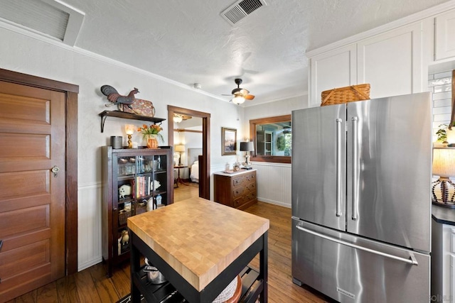 kitchen with ceiling fan, wood-type flooring, high end fridge, and white cabinets