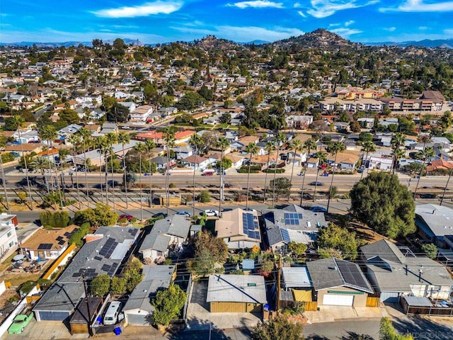 birds eye view of property with a mountain view