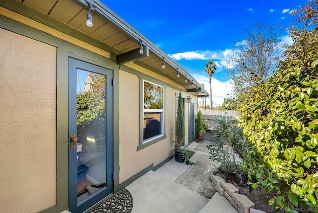 view of property exterior with a patio area