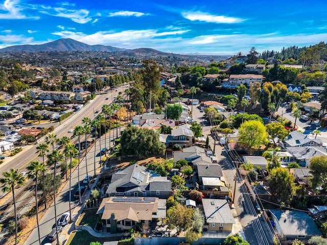 birds eye view of property with a mountain view