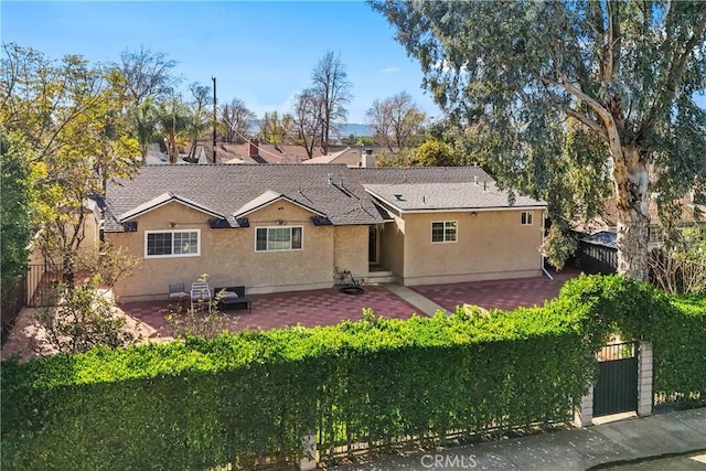 rear view of house with a patio area