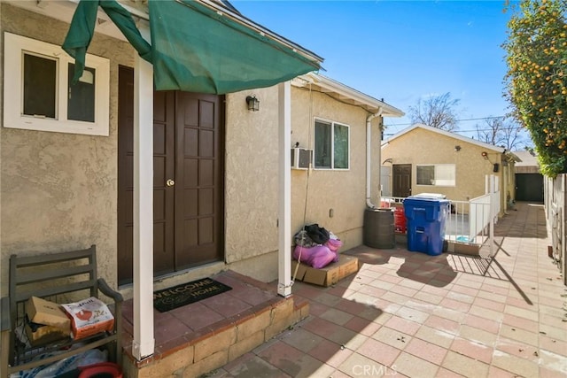 property entrance with a patio