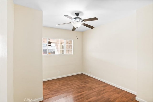 spare room featuring hardwood / wood-style flooring and ceiling fan